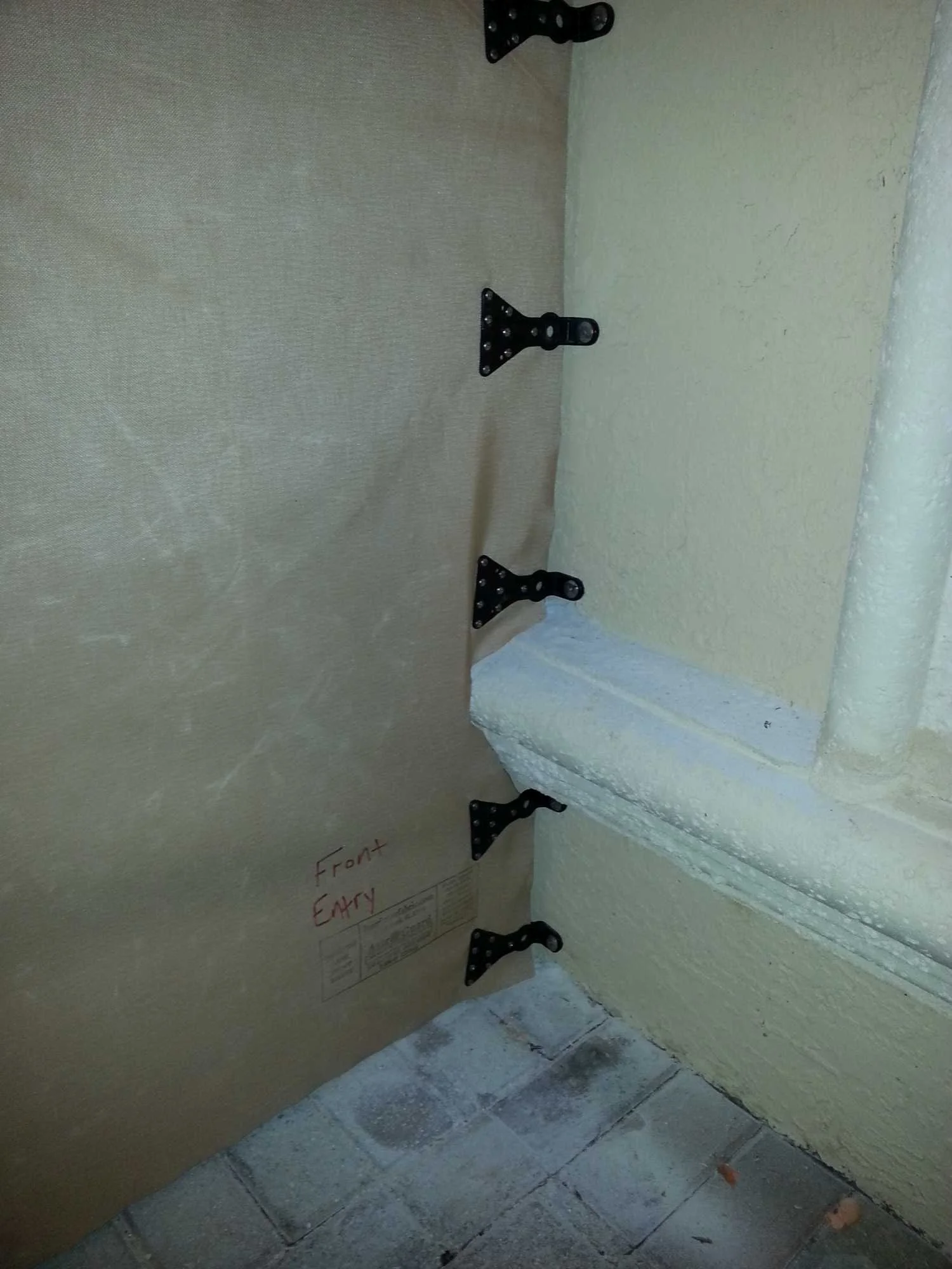 Close-up of AstroGuard patented T-clip hardware notched into panel — Los Cabos hurricane protection